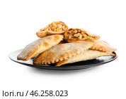 Plate of baked meat empanadas on white background. Стоковое фото, фотограф Pixel_shot / Фотобанк Лори