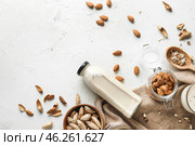 Tasty almond milk on white background. Стоковое фото, фотограф Pixel_shot / Фотобанк Лори