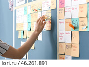 Young woman near scrum task board in office. Стоковое фото, фотограф Pixel_shot / Фотобанк Лори