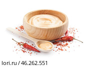 Wooden bowl of tasty chipotle sauce isolated on white background. Стоковое фото, фотограф Pixel_shot / Фотобанк Лори