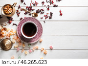 Composition with cup of tea and rahat lakoum on white wooden table. Стоковое фото, фотограф Pixel_shot / Фотобанк Лори