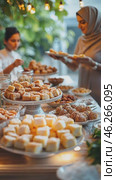 Women serving traditional sweets at a festive table. Стоковое AI-видео, аниматор Юрий Поздников / Фотобанк Лори