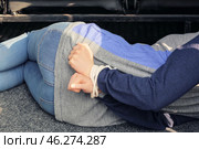 Female hostage with tied hands lying inside car, closeup. Стоковое фото, фотограф Pixel_shot / Фотобанк Лори