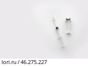 Syringe with filler for cosmetology and ampule on light background. Стоковое фото, фотограф Pixel_shot / Фотобанк Лори