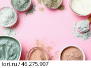 Frame made of cosmetic clays in bowls on color background. Стоковое фото, фотограф Pixel_shot / Фотобанк Лори