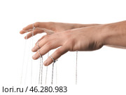 Hands of puppeteer on white background. Стоковое фото, фотограф Pixel_shot / Фотобанк Лори