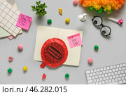 Computer keyboard with whoopee cushion, funny glasses and sticky notes on white background. April Fools Day prank. Стоковое фото, фотограф Pixel_shot / Фотобанк Лори