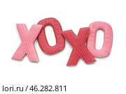 Sweet cookies in shape of XO symbol isolated on white background. Valentine's Day celebration. Стоковое фото, фотограф Pixel_shot / Фотобанк Лори