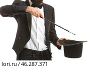 Magician showing tricks on white background. Стоковое фото, фотограф Pixel_shot / Фотобанк Лори