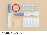 Different contraceptives and pregnancy tests on color background. Стоковое фото, фотограф Pixel_shot / Фотобанк Лори