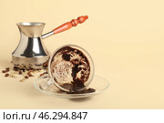 Jezve and cup with spent coffee grounds for fortune telling on color background. Стоковое фото, фотограф Pixel_shot / Фотобанк Лори