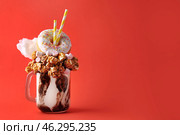 Delicious freak shake on color background. Стоковое фото, фотограф Pixel_shot / Фотобанк Лори