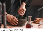 Male alchemist making elixir in laboratory, closeup. Стоковое фото, фотограф Pixel_shot / Фотобанк Лори