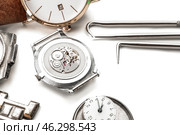 Watches and tools for repair on white background. Стоковое фото, фотограф Pixel_shot / Фотобанк Лори
