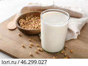 Glass of tasty soy milk on wooden board. Стоковое фото, фотограф Pixel_shot / Фотобанк Лори