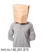 Male hostage with paper bag on white background. Стоковое фото, фотограф Pixel_shot / Фотобанк Лори