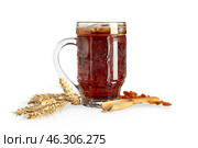 Mug of tasty kvass, spikelets, yeast and raisins on white background. Стоковое фото, фотограф Pixel_shot / Фотобанк Лори