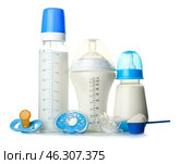 Bottles of milk with pacifiers and baby formula on white background. Стоковое фото, фотограф Pixel_shot / Фотобанк Лори