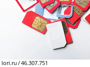Many sim cards on white background. Стоковое фото, фотограф Pixel_shot / Фотобанк Лори