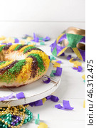 Festive cake for Mardi Gras (Fat Tuesday) holiday on white table. Стоковое фото, фотограф Pixel_shot / Фотобанк Лори