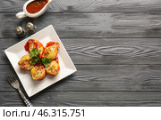 Plate with tasty conchiglioni pasta on table. Стоковое фото, фотограф Pixel_shot / Фотобанк Лори