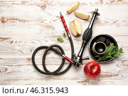 Parts of hookah and apple on wooden background. Стоковое фото, фотограф Pixel_shot / Фотобанк Лори