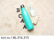 Letters BCAA, bottle of water, amino acid pills and powder on grunge background. Стоковое фото, фотограф Pixel_shot / Фотобанк Лори