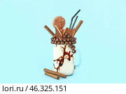 Mason jar with delicious freak shake on color background. Стоковое фото, фотограф Pixel_shot / Фотобанк Лори