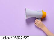 Woman with megaphone on color background. Стоковое фото, фотограф Pixel_shot / Фотобанк Лори