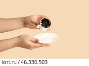 Woman reading coffee grounds on color background. Стоковое фото, фотограф Pixel_shot / Фотобанк Лори