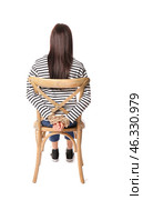 Female hostage sitting on chair against white background. Стоковое фото, фотограф Pixel_shot / Фотобанк Лори