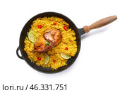 Frying pan of traditional chicken biryani isolated on white background. Стоковое фото, фотограф Pixel_shot / Фотобанк Лори