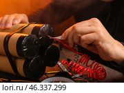 Terrorist making bomb at table, closeup. Стоковое фото, фотограф Pixel_shot / Фотобанк Лори