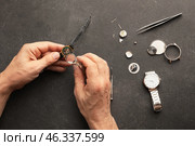 Clockmaker repairing broken watch at table. Стоковое фото, фотограф Pixel_shot / Фотобанк Лори