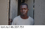 Young man staring at the camera with a serious gaze. Стоковое видео, видеограф Данил Руденко / Фотобанк Лори