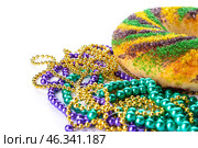 Festive cake for Mardi Gras (Fat Tuesday) holiday with beads on white background. Стоковое фото, фотограф Pixel_shot / Фотобанк Лори
