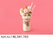 Glass with delicious freak shake on color background. Стоковое фото, фотограф Pixel_shot / Фотобанк Лори