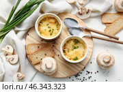 Ramekins with tasty julienne and ingredients on light background. Стоковое фото, фотограф Pixel_shot / Фотобанк Лори