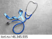 Blue ribbon and stethoscope on grey background. Prostate cancer awareness. Стоковое фото, фотограф Pixel_shot / Фотобанк Лори