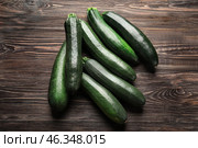 Ripe zucchinis on wooden table. Стоковое фото, фотограф Pixel_shot / Фотобанк Лори