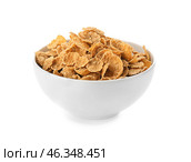 Bowl with healthy cornflakes on white background. Стоковое фото, фотограф Pixel_shot / Фотобанк Лори