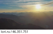 Flying over colorful foliage at sunset in mountains. Стоковое видео, видеограф Михаил Коханчиков / Фотобанк Лори