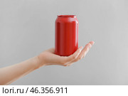 Hand with can of soda on grey background. Стоковое фото, фотограф Pixel_shot / Фотобанк Лори