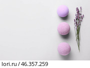 Bath bombs and lavender flowers on light background. Стоковое фото, фотограф Pixel_shot / Фотобанк Лори
