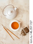 Composition with dry hojicha green tea on light background. Стоковое фото, фотограф Pixel_shot / Фотобанк Лори