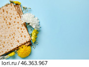 Jewish flatbread with flowers on color background. Стоковое фото, фотограф Pixel_shot / Фотобанк Лори