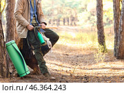 Male tourist with backpack and survival kit in forest. Стоковое фото, фотограф Pixel_shot / Фотобанк Лори