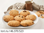 Plate with sweet cookies and jezve of aromatic coffee on table. Стоковое фото, фотограф Pixel_shot / Фотобанк Лори