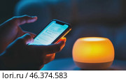 Point finger on screen phone closeup, person testing test message, touch blue screen on smartphone. Night Bokeh Light. Close-UP. Person using in hands mobile phone close up in the dark. Online wi-fi. Стоковое AI-видео, аниматор Марина Демидюк / Фотобанк Лори