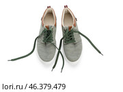 Pair of shoes with untied laces on white background. Стоковое фото, фотограф Pixel_shot / Фотобанк Лори